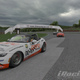 The Team Oppo Miata piloted by bwp240 races through Turn 1 at Lime Rock